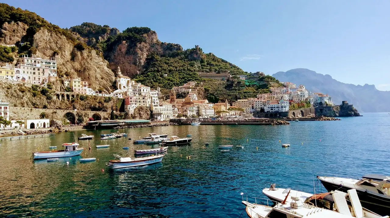 Small boats in the bay at Amalfi, with the town on the cliffs