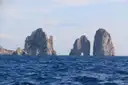 The Faraglioni rocks rising out of the sea off Capri