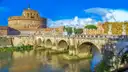 Castel Sant'Angelo and its bridge under a bright blue sky