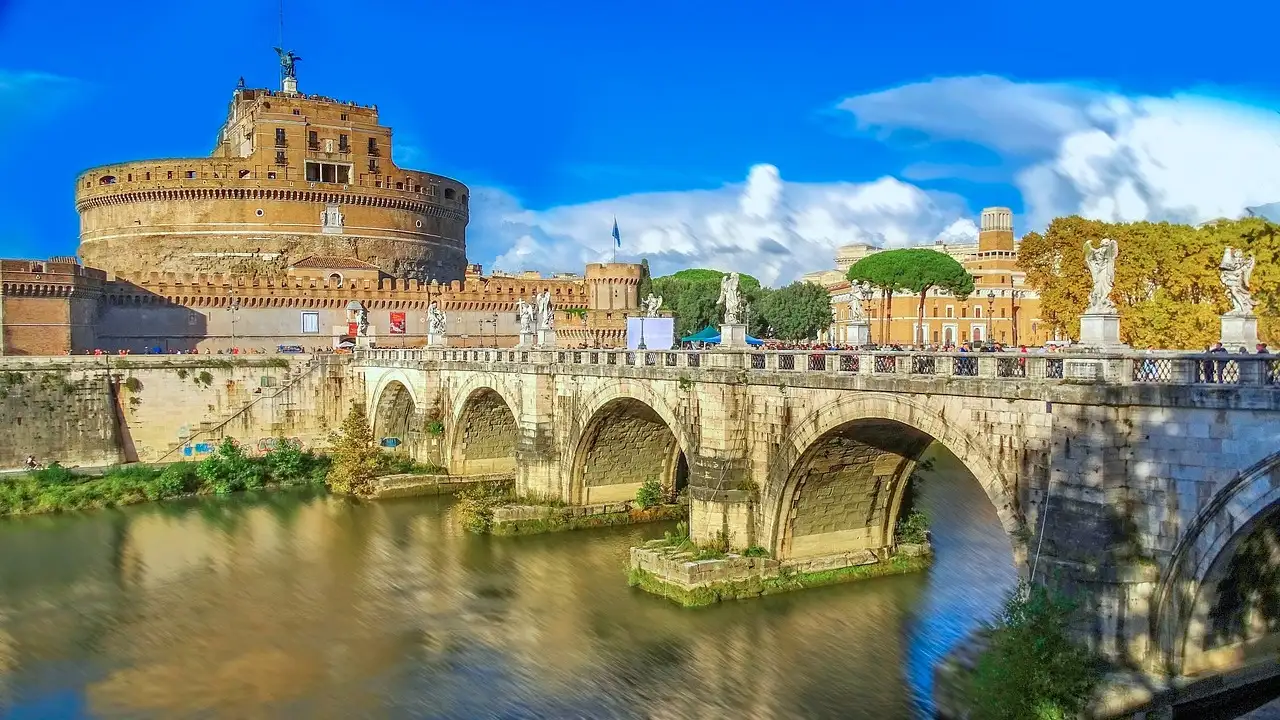 Castel Sant'Angelo and its bridge under a bright blue sky