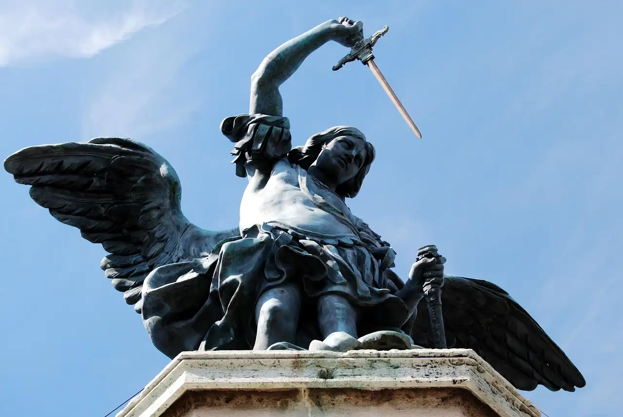 The bronze angel on top of Castel Sant'Angelo against a blue sky