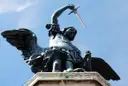 The bronze angel on top of Castel Sant'Angelo against a blue sky