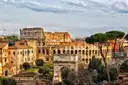 The Colosseum and the Arch of Constantine seen from the Palatine side, with pine trees