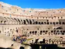 Sunlit tiers of seating inside the Colosseum