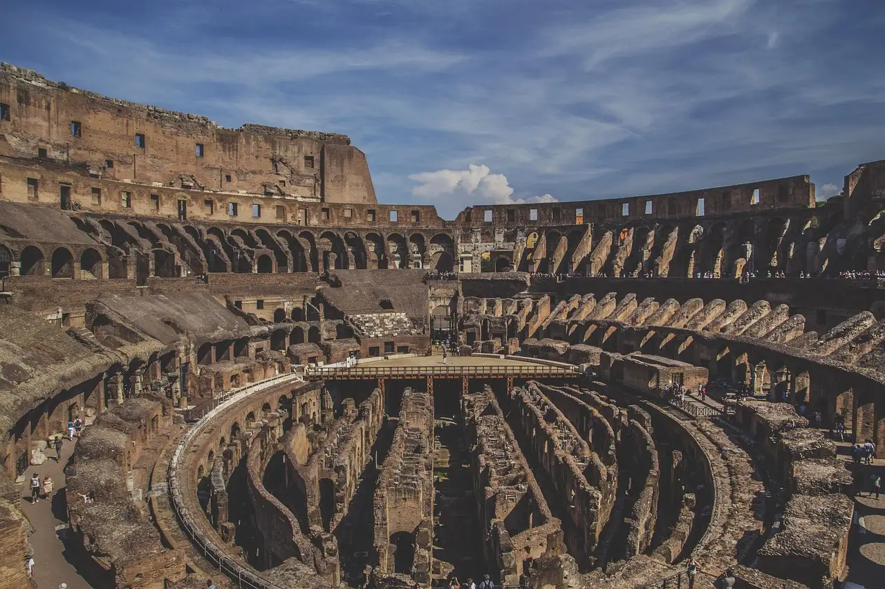 The underground passages of the Colosseum seen from the stands, under a cloudy sky