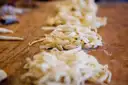 Nests of fresh pasta on a table