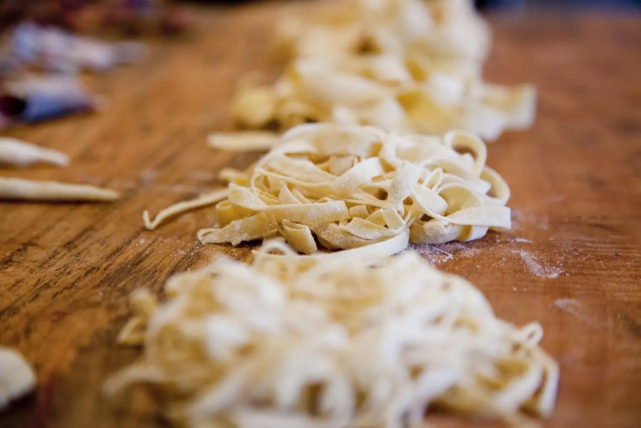 Nests of fresh pasta on a table