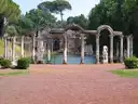 Statues and arches around the long pool of the Canopus at Hadrian's Villa
