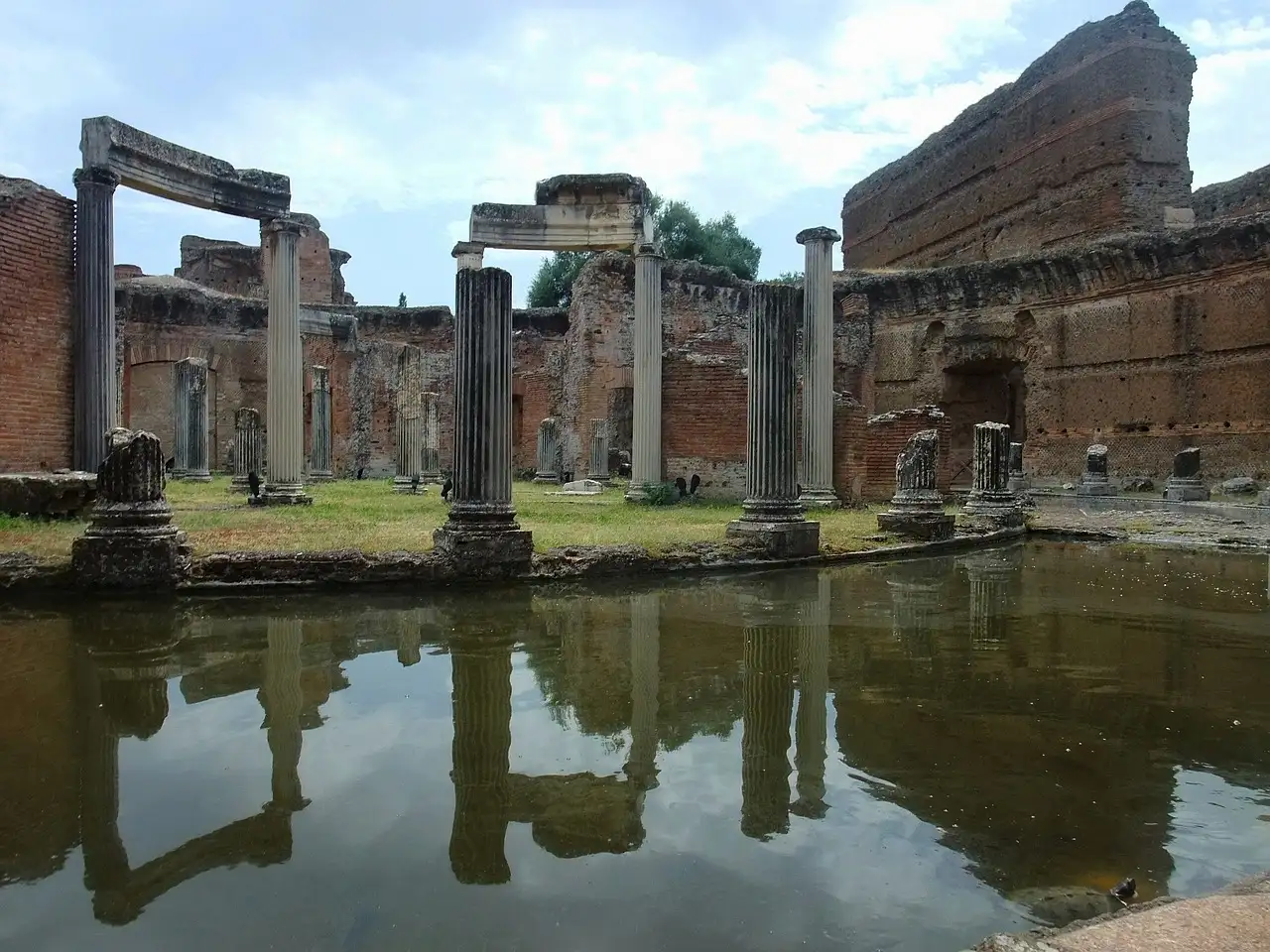 Columns and brick ruins reflected in a pool at Hadrian's Villa