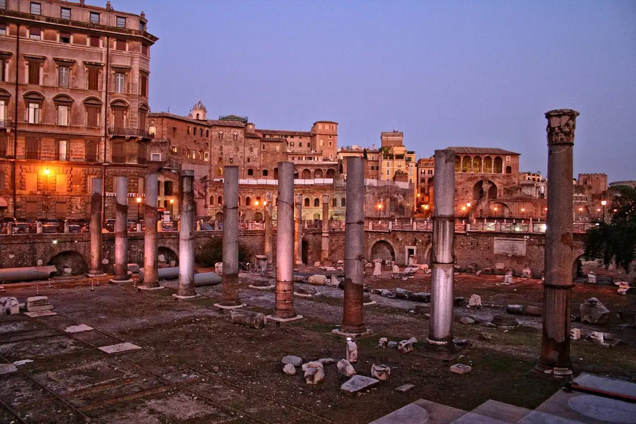 Rows of old columns in an imperial forum in Rome at dusk