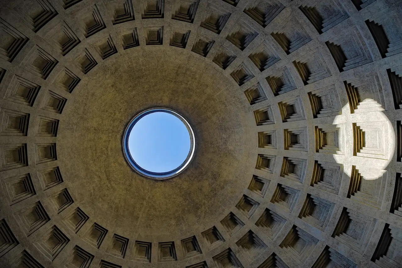 Looking up at the Pantheon dome, with sky showing through the round opening at the top