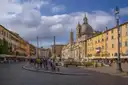 Piazza Navona in Rome with its domed church, fountain and cafés