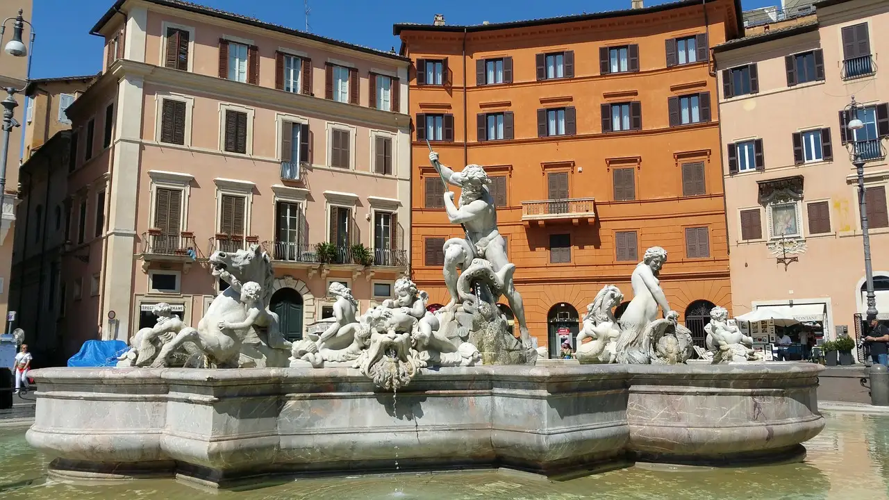 The Neptune Fountain and painted houses in Piazza Navona, Rome