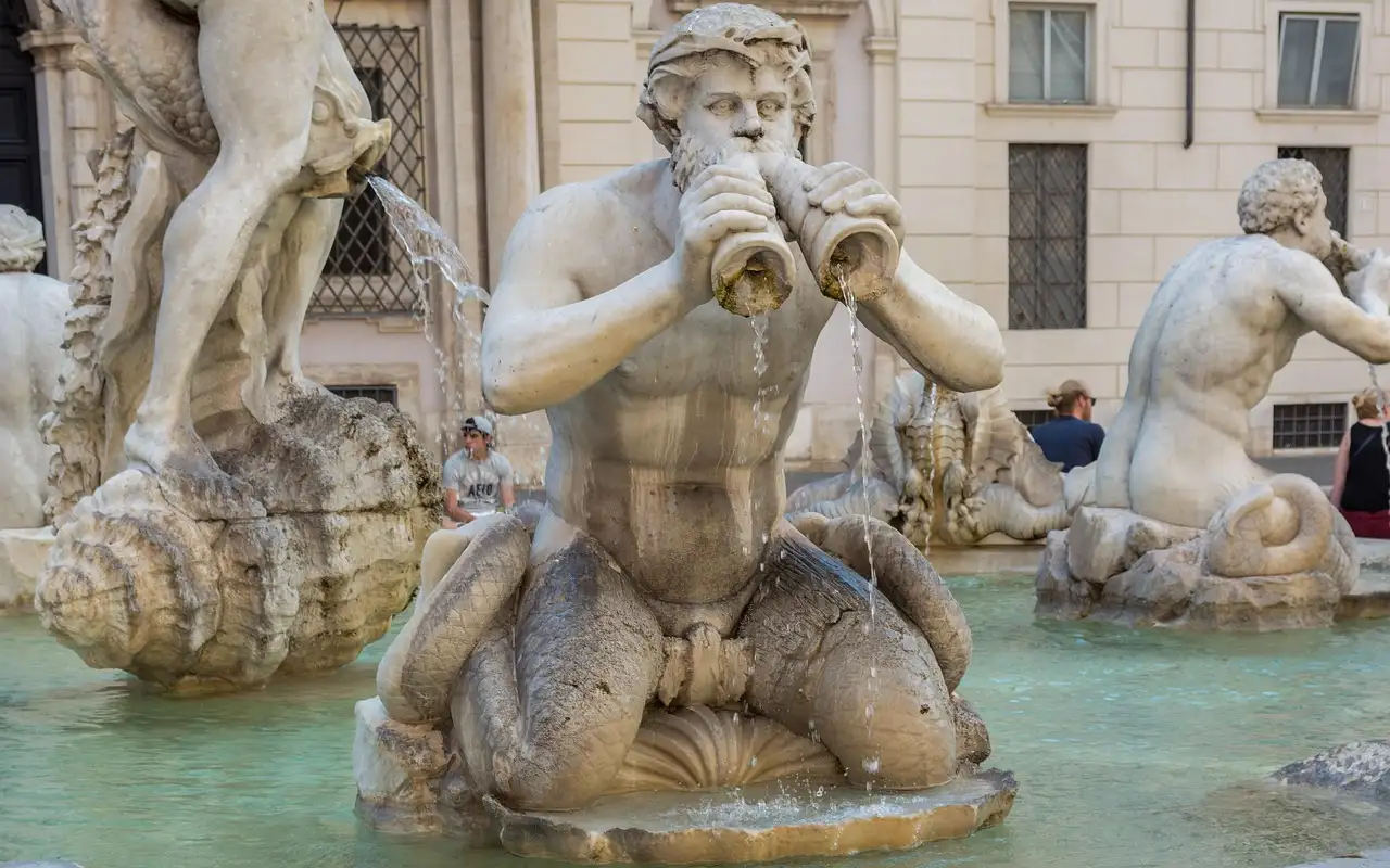 A marble sea god in a fountain on Piazza Navona