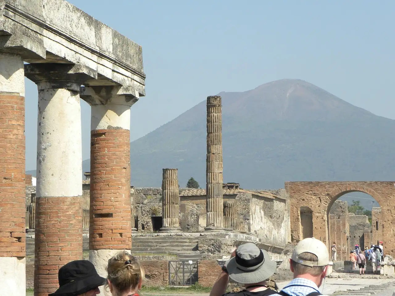 Columns of the forum in Pompeii with Mount Vesuvius behind them
