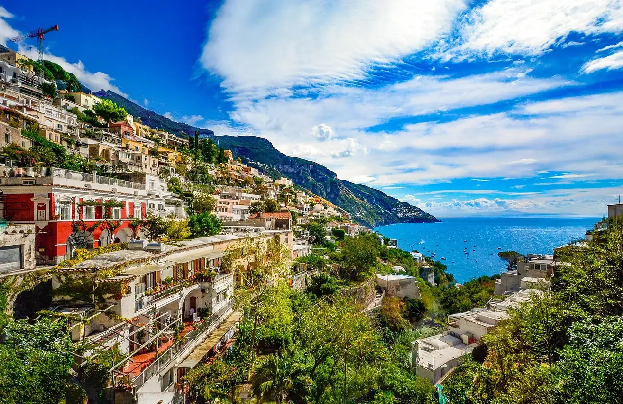 Colorful houses of Positano on the green hillside above the sea