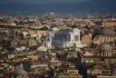 Rome rooftops and domes with the white Vittoriano monument in the middle