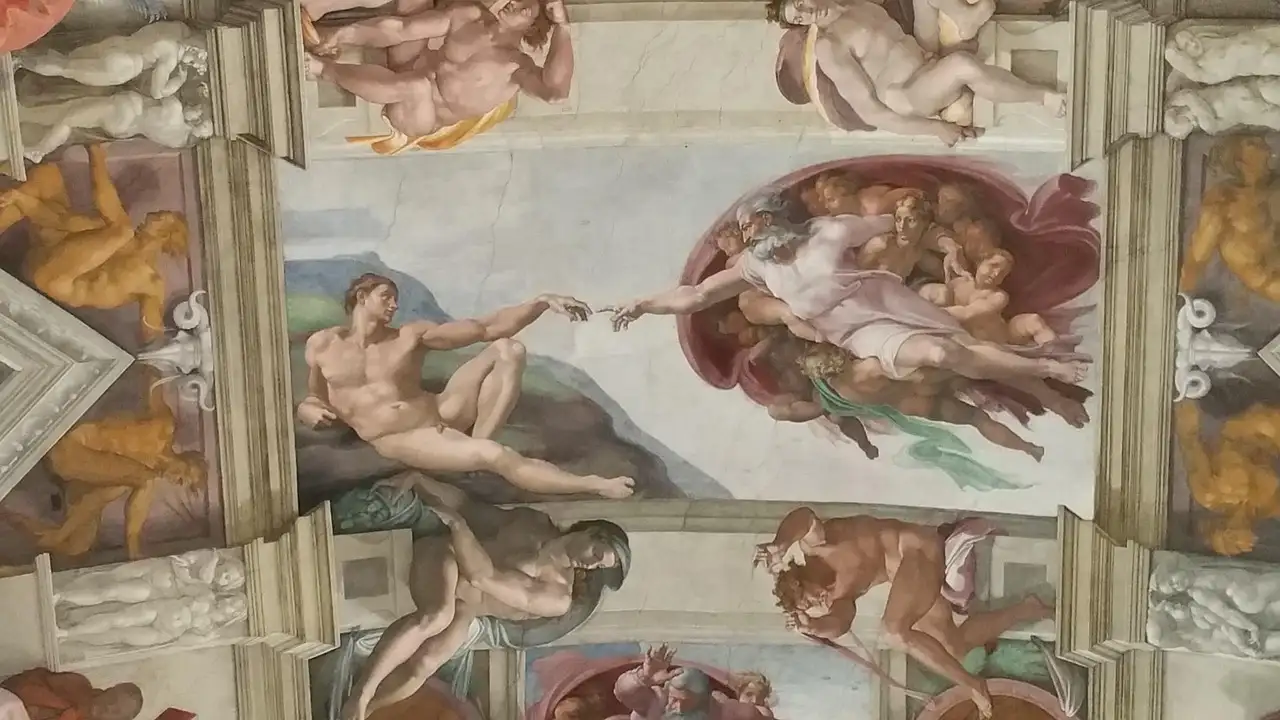 Part of the Sistine Chapel ceiling, with The Creation of Adam in the middle