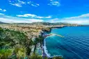 The coast near Sorrento from above, with the town by a deep blue sea
