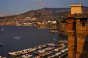 Boats in the harbor at Sorrento at dusk, below the cliffs