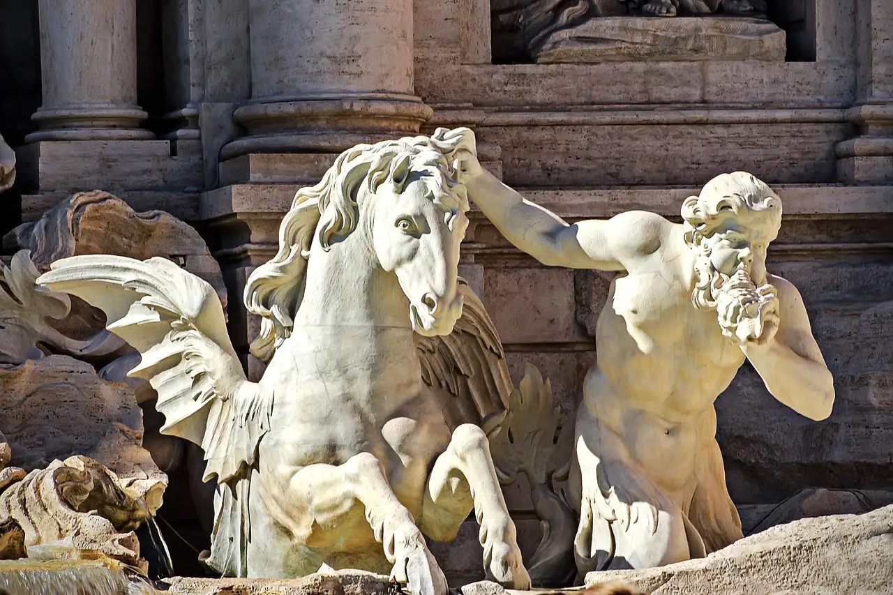 A winged sea horse and its tamer, carved in marble, on the Trevi Fountain
