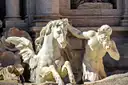 A winged sea horse and its tamer, carved in marble, on the Trevi Fountain