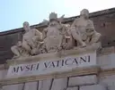 The stone sign "Musei Vaticani" with statues above the Vatican Museums entrance