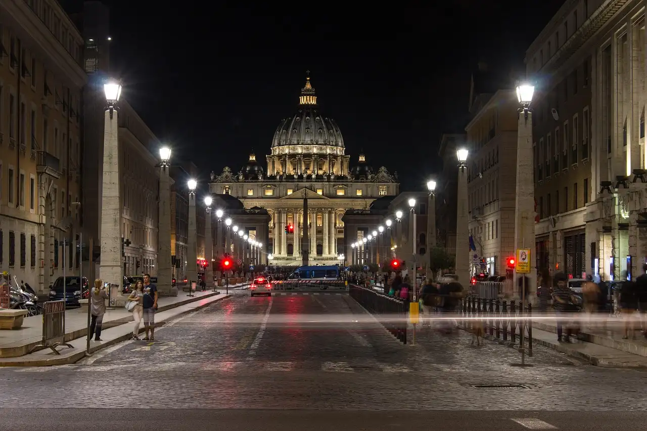 Via della Conciliazione lit up at night, leading to St. Peter's Basilica