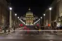 Via della Conciliazione lit up at night, leading to St. Peter's Basilica