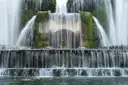 Water pouring over the tiers of a big fountain in the gardens of Villa d'Este